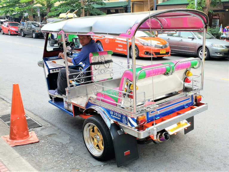 Tuk-tuk driver waiting for a passenger