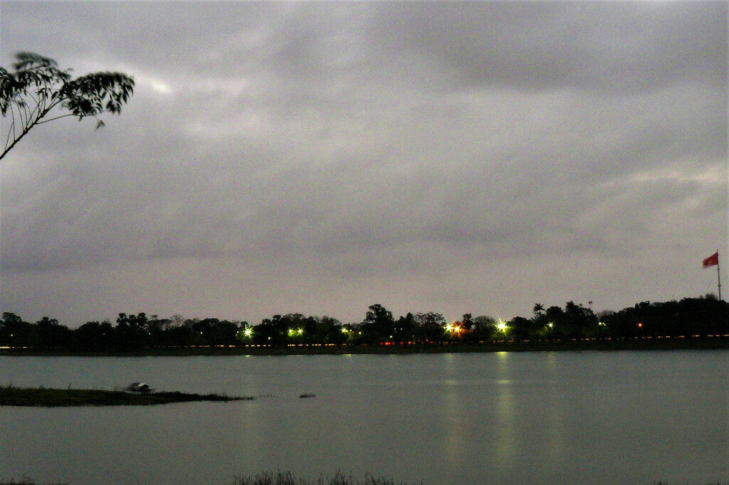 View of the Perfume river with Citadel flag fluttering late in the evening.