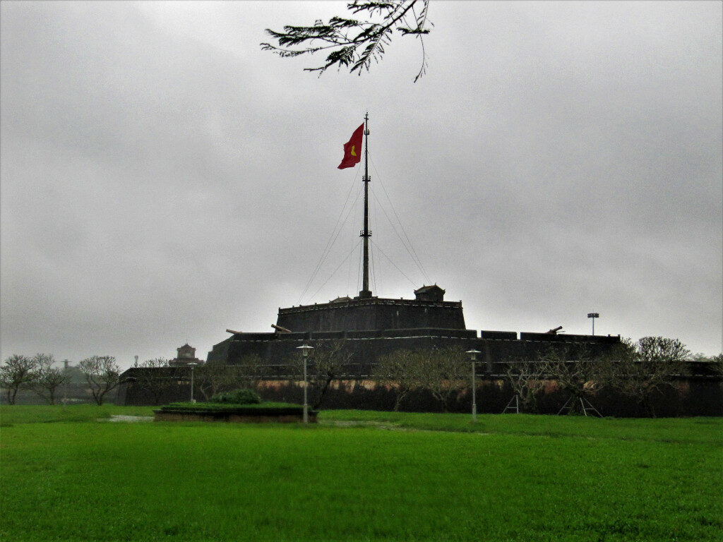 Vietnamese flag fluttering atop the Citadel.