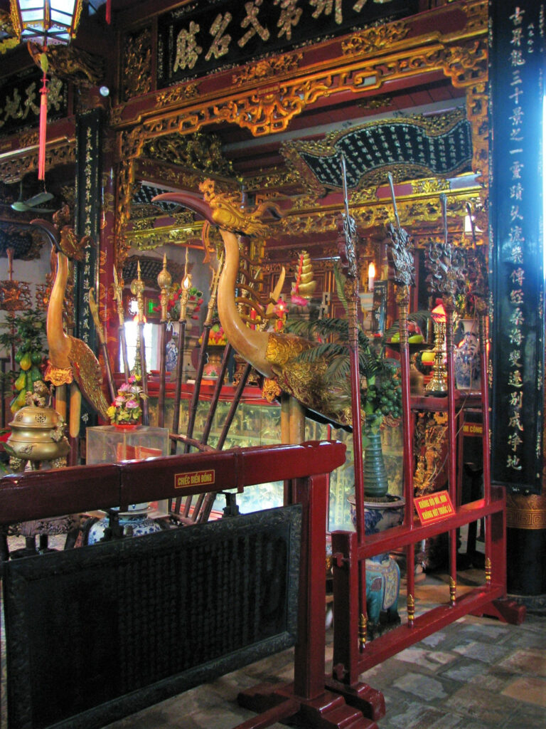 Two cranes stand guard in front of the shrine at Quan Thanh temple Hanoi