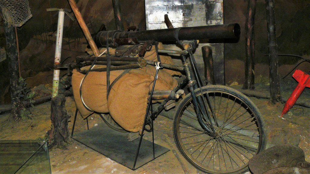 A bicycle with a mortar launcher mounted on it as part of the diorama at the Military Museum Hanoi