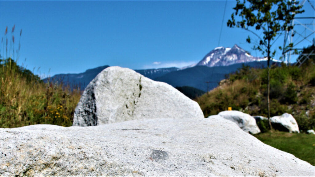 Garibaldi mountain in the background with a stone cliff in the foreground