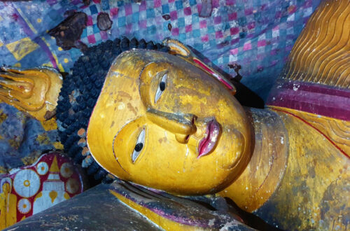 A reclining Buddha inside one of the caves