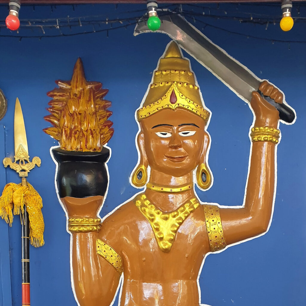 A painting on the wall of a smaller temple inside the compound