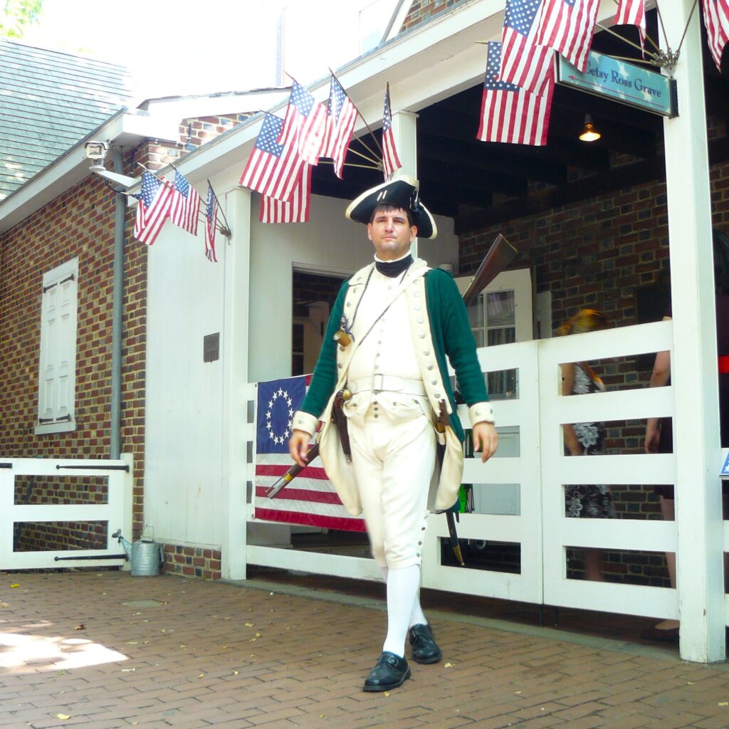 Dressed in army uniform, he keeps an eye out for eager tourists.