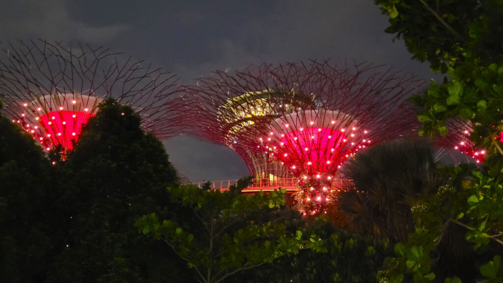 Accompanied to music, various hues of colors light up the night sky.