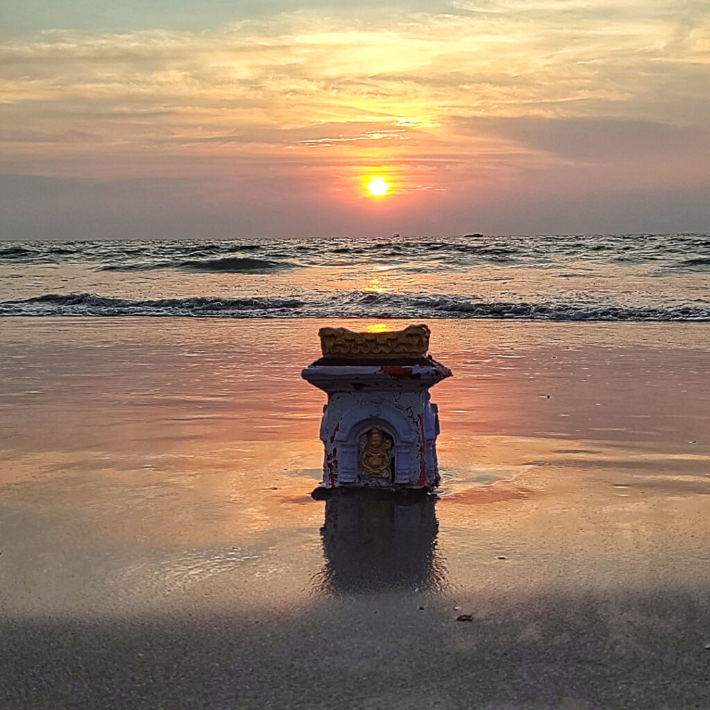 A Hindu idol that would have been used for an immersion, waiting to be lapped up by the high tides.