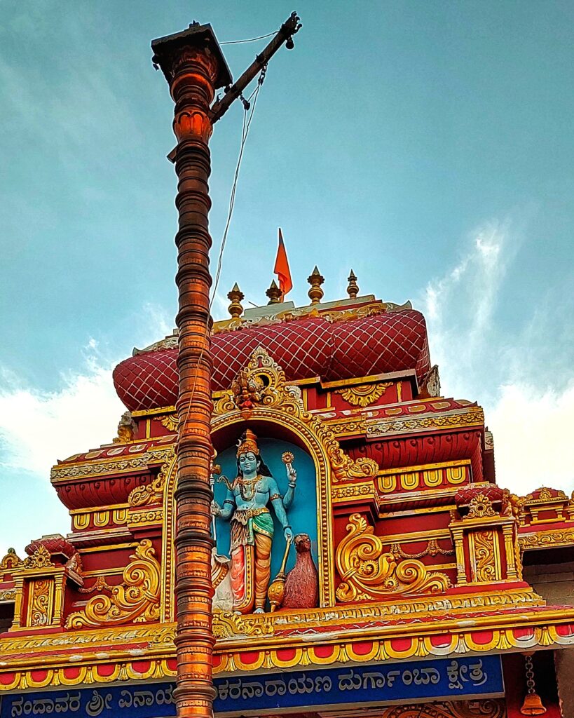 A view of the newly erected brass covered gopuram.