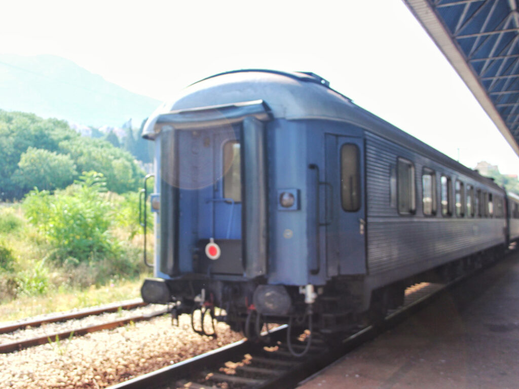A waiting carriage on one of the tracks at the station.